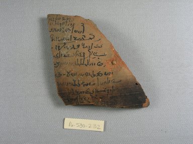  <em>Demotic Ostracon</em>, Year 15. Terracotta, pigment, 3 5/8 x 3/8 x 3 3/4 in. (9.2 x 1 x 9.6 cm). Brooklyn Museum, Gift of Evangeline Wilbour Blashfield, Theodora Wilbour, and Victor Wilbour honoring the wishes of their mother, Charlotte Beebe Wilbour, as a memorial to their father, Charles Edwin Wilbour, 16.580.232. Creative Commons-BY (Photo: Brooklyn Museum, CUR.16.580.232_view1.jpg)