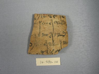  <em>Demotic Ostracon</em>. Terracotta, pigment, 2 5/8 x 1/4 x 2 13/16 in. (6.6 x 0.7 x 7.2 cm). Brooklyn Museum, Gift of Evangeline Wilbour Blashfield, Theodora Wilbour, and Victor Wilbour honoring the wishes of their mother, Charlotte Beebe Wilbour, as a memorial to their father, Charles Edwin Wilbour, 16.580.241. Creative Commons-BY (Photo: Brooklyn Museum, CUR.16.580.241_view1.jpg)