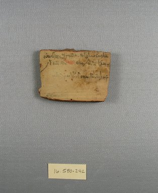  <em>Demotic Ostracon</em>. Terracotta, pigment, 2 1/16 x 5/16 x 2 13/16 in. (5.2 x 0.8 x 7.2 cm). Brooklyn Museum, Gift of Evangeline Wilbour Blashfield, Theodora Wilbour, and Victor Wilbour honoring the wishes of their mother, Charlotte Beebe Wilbour, as a memorial to their father, Charles Edwin Wilbour, 16.580.242. Creative Commons-BY (Photo: Brooklyn Museum, CUR.16.580.242_view1.jpg)