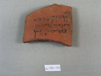  <em>Demotic Ostracon</em>, Year 2 of Tiberius?. Terracotta, pigment, 2 11/16 x 3/8 x 3 1/8 in. (6.9 x 0.9 x 7.9 cm). Brooklyn Museum, Gift of Evangeline Wilbour Blashfield, Theodora Wilbour, and Victor Wilbour honoring the wishes of their mother, Charlotte Beebe Wilbour, as a memorial to their father, Charles Edwin Wilbour, 16.580.243. Creative Commons-BY (Photo: Brooklyn Museum, CUR.16.580.243_view1.jpg)