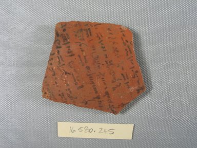  <em>Demotic Ostracon</em>. Terracotta, pigment, 2 9/16 x 5/16 x 2 5/8 in. (6.5 x 0.8 x 6.7 cm). Brooklyn Museum, Gift of Evangeline Wilbour Blashfield, Theodora Wilbour, and Victor Wilbour honoring the wishes of their mother, Charlotte Beebe Wilbour, as a memorial to their father, Charles Edwin Wilbour, 16.580.245. Creative Commons-BY (Photo: Brooklyn Museum, CUR.16.580.245_view1.jpg)