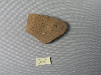 Demotic. <em>Demotic Ostracon</em>, Year 30 of a Ptolemy (?). Terracotta, pigment, 1 7/8 x 1/4 x 2 3/4 in. (4.7 x 0.7 x 7 cm). Brooklyn Museum, Gift of Evangeline Wilbour Blashfield, Theodora Wilbour, and Victor Wilbour honoring the wishes of their mother, Charlotte Beebe Wilbour, as a memorial to their father, Charles Edwin Wilbour, 16.580.498. Creative Commons-BY (Photo: Brooklyn Museum, CUR.16.580.498_view1.jpg)