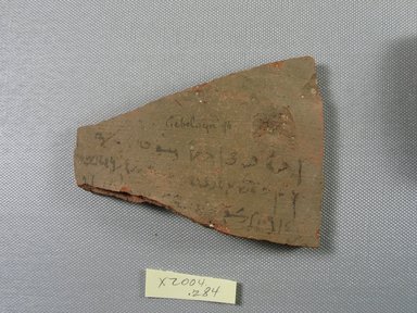 Demotic. <em>Demotic Ostracon</em>, Year 16. Terracotta, pigment, 3 1/4 x 1/4 x 4 5/16 in. (8.3 x 0.7 x 11 cm). Brooklyn Museum, Gift of Evangeline Wilbour Blashfield, Theodora Wilbour, and Victor Wilbour honoring the wishes of their mother, Charlotte Beebe Wilbour, as a memorial to their father, Charles Edwin Wilbour, 16.580.503. Creative Commons-BY (Photo: Brooklyn Museum, CUR.16.580.503_view1.jpg)