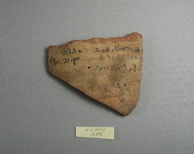 Demotic. <em>Demotic Ostracon</em>, Year 25 (of Ptolemy II Philadelphus). Terracotta, pigment, 3 9/16 x 1/4 x 4 in. (9.1 x 0.7 x 10.2 cm). Brooklyn Museum, Gift of Evangeline Wilbour Blashfield, Theodora Wilbour, and Victor Wilbour honoring the wishes of their mother, Charlotte Beebe Wilbour, as a memorial to their father, Charles Edwin Wilbour, 16.580.504. Creative Commons-BY (Photo: Brooklyn Museum, CUR.16.580.504_view1.jpg)