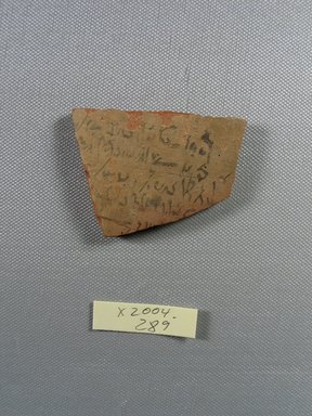 Demotic. <em>Demotic Ostracon</em>, Year 33 of Augustus. Terracotta, pigment, 1 15/16 x 1/4 x 2 5/8 in. (4.9 x 0.6 x 6.7 cm). Brooklyn Museum, Gift of Evangeline Wilbour Blashfield, Theodora Wilbour, and Victor Wilbour honoring the wishes of their mother, Charlotte Beebe Wilbour, as a memorial to their father, Charles Edwin Wilbour, 16.580.507. Creative Commons-BY (Photo: Brooklyn Museum, CUR.16.580.507_view1.jpg)