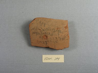 Demotic. <em>Demotic Ostracon</em>, Year 15 of a Ptolemy. Terracotta, pigment, 2 3/16 x 3/8 x 2 3/4 in. (5.6 x 0.9 x 7 cm). Brooklyn Museum, Gift of Evangeline Wilbour Blashfield, Theodora Wilbour, and Victor Wilbour honoring the wishes of their mother, Charlotte Beebe Wilbour, as a memorial to their father, Charles Edwin Wilbour, 16.580.512. Creative Commons-BY (Photo: Brooklyn Museum, CUR.16.580.512_view1.jpg)