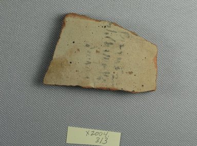 Demotic. <em>Demotic Ostracon</em>, Year 4 of a Ptolemy?. Terracotta, pigment, 2 1/8 x 3/8 x 3 1/8 in. (5.4 x 1 x 7.9 cm). Brooklyn Museum, Gift of Evangeline Wilbour Blashfield, Theodora Wilbour, and Victor Wilbour honoring the wishes of their mother, Charlotte Beebe Wilbour, as a memorial to their father, Charles Edwin Wilbour, 16.580.530. Creative Commons-BY (Photo: Brooklyn Museum, CUR.16.580.530_view1.jpg)