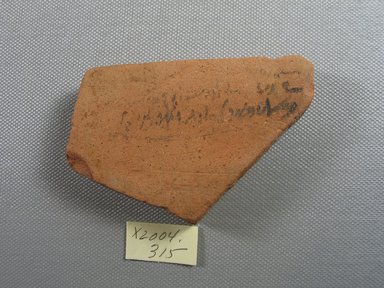 Demotic. <em>Demotic Ostracon</em>, Year 10 of a Ptolemy. Terracotta, pigment, 2 1/4 x 1/2 x 3 1/2 in. (5.7 x 1.2 x 8.9 cm). Brooklyn Museum, Gift of Evangeline Wilbour Blashfield, Theodora Wilbour, and Victor Wilbour honoring the wishes of their mother, Charlotte Beebe Wilbour, as a memorial to their father, Charles Edwin Wilbour, 16.580.532. Creative Commons-BY (Photo: Brooklyn Museum, CUR.16.580.532_view1.jpg)