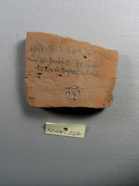 Demotic. <em>Demotic Ostracon</em>, Year 42 of Augustus. Terracotta, pigment, 2 5/8 x 3/8 x 3 1/4 in. (6.6 x 1 x 8.3 cm). Brooklyn Museum, Gift of Evangeline Wilbour Blashfield, Theodora Wilbour, and Victor Wilbour honoring the wishes of their mother, Charlotte Beebe Wilbour, as a memorial to their father, Charles Edwin Wilbour, 16.580.543. Creative Commons-BY (Photo: Brooklyn Museum, CUR.16.580.543_view1.jpg)