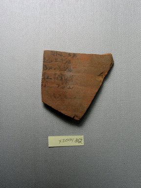 Demotic. <em>Demotic Ostracon</em>. Terracotta, pigment, 2 7/8 x 3/16 x 3 in. (7.3 x 0.5 x 7.6 cm). Brooklyn Museum, Gift of Evangeline Wilbour Blashfield, Theodora Wilbour, and Victor Wilbour honoring the wishes of their mother, Charlotte Beebe Wilbour, as a memorial to their father, Charles Edwin Wilbour, 16.580.564. Creative Commons-BY (Photo: Brooklyn Museum, CUR.16.580.564_view1.jpg)