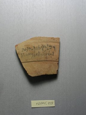 Demotic. <em>Demotic Ostracon</em>, Year 16 (of Ptolemy II Philadelphus?). Terracotta, pigment, 2 7/16 x 5/16 x 2 15/16 in. (6.2 x 0.8 x 7.5 cm). Brooklyn Museum, Gift of Evangeline Wilbour Blashfield, Theodora Wilbour, and Victor Wilbour honoring the wishes of their mother, Charlotte Beebe Wilbour, as a memorial to their father, Charles Edwin Wilbour, 16.580.569. Creative Commons-BY (Photo: Brooklyn Museum, CUR.16.580.569_view1.jpg)