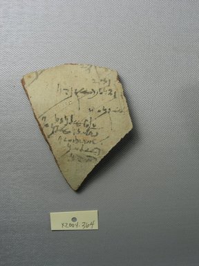 Demotic. <em>Demotic Ostracon</em>. Terracotta, pigment, 3 3/8 x 5/16 x 3 3/4 in. (8.6 x 0.8 x 9.6 cm). Brooklyn Museum, Gift of Evangeline Wilbour Blashfield, Theodora Wilbour, and Victor Wilbour honoring the wishes of their mother, Charlotte Beebe Wilbour, as a memorial to their father, Charles Edwin Wilbour, 16.580.575. Creative Commons-BY (Photo: Brooklyn Museum, CUR.16.580.575_view1.jpg)