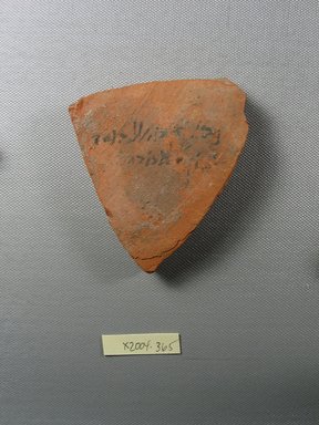 Demotic. <em>Demotic Ostracon</em>, Year 26 (of Ptolemy II Philadelphus?). Terracotta, pigment, 3 1/4 x 9/16 x 3 7/8 in. (8.3 x 1.5 x 9.9 cm). Brooklyn Museum, Gift of Evangeline Wilbour Blashfield, Theodora Wilbour, and Victor Wilbour honoring the wishes of their mother, Charlotte Beebe Wilbour, as a memorial to their father, Charles Edwin Wilbour, 16.580.576. Creative Commons-BY (Photo: Brooklyn Museum, CUR.16.580.576_view1.jpg)
