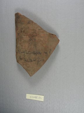 Demotic. <em>Demotic Ostracon</em>. Terracotta, pigment, 3 3/8 x 3/8 x 5 1/16 in. (8.5 x 1 x 12.8 cm). Brooklyn Museum, Gift of Evangeline Wilbour Blashfield, Theodora Wilbour, and Victor Wilbour honoring the wishes of their mother, Charlotte Beebe Wilbour, as a memorial to their father, Charles Edwin Wilbour, 16.580.582. Creative Commons-BY (Photo: Brooklyn Museum, CUR.16.580.582_view1.jpg)