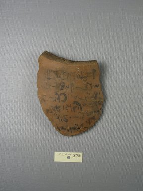 Demotic. <em>Demotic Ostracon</em>, Year 8 of a late Ptolemaic or early Roman reign. Terracotta, pigment, 3 1/2 x 7/16 x 4 5/8 in. (8.9 x 1.1 x 11.7 cm). Brooklyn Museum, Gift of Evangeline Wilbour Blashfield, Theodora Wilbour, and Victor Wilbour honoring the wishes of their mother, Charlotte Beebe Wilbour, as a memorial to their father, Charles Edwin Wilbour, 16.580.587. Creative Commons-BY (Photo: Brooklyn Museum, CUR.16.580.587_view1.jpg)