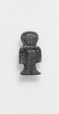  <em>Isis-knot Amulet</em>, ca. 1539–1075 B.C.E. Faience, 1/4 x 3/16 x 9/16 in. (0.7 x 0.5 x 1.5 cm). Brooklyn Museum, Gift of Evangeline Wilbour Blashfield, Theodora Wilbour, and Victor Wilbour honoring the wishes of their mother, Charlotte Beebe Wilbour, as a memorial to their father Charles Edwin Wilbour, 16.580.68. Creative Commons-BY (Photo: Brooklyn Museum, CUR.16.580.68_NegID_16.580.65_GRPA_print_cropped_bw.jpg)