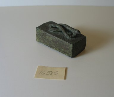  <em>Small, Oblong Container</em>, 332 B.C.E-30 C.E. Bronze, 1 3/16 x 1 3/16 x 2 7/16 in. (3 x 3 x 6.2 cm). Brooklyn Museum, Gift of Evangeline Wilbour Blashfield, Theodora Wilbour, and Victor Wilbour honoring the wishes of their mother, Charlotte Beebe Wilbour, as a memorial to their father, Charles Edwin Wilbour, 16.585. Creative Commons-BY (Photo: Brooklyn Museum, CUR.16.585_view1.jpg)