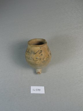 Egyptian. <em>Pot with Demotic Inscription</em>, 664-332 B.C.E. or later. Terracotta, pigment, 2 7/16 x greatest diam. 1 13/16 in. (6.2 x 4.6 cm). Brooklyn Museum, Gift of Evangeline Wilbour Blashfield, Theodora Wilbour, and Victor Wilbour honoring the wishes of their mother, Charlotte Beebe Wilbour, as a memorial to their father, Charles Edwin Wilbour, 16.589. Creative Commons-BY (Photo: Brooklyn Museum, CUR.16.589_view1.jpg)