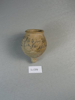 Arabian. <em>Pot with Demotic Inscription</em>, 664-332 B.C.E. or later. Terracotta, pigment, 2 7/16 x greatest diam. 1 13/16 in. (6.2 x 4.6 cm). Brooklyn Museum, Gift of Evangeline Wilbour Blashfield, Theodora Wilbour, and Victor Wilbour honoring the wishes of their mother, Charlotte Beebe Wilbour, as a memorial to their father, Charles Edwin Wilbour, 16.589. Creative Commons-BY (Photo: Brooklyn Museum, CUR.16.589_view4.jpg)