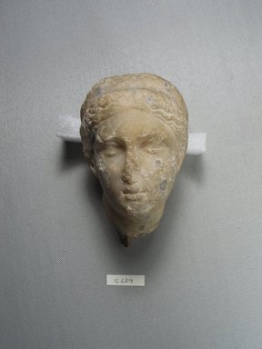  <em>Head of a Woman</em>, later than the 4th century B.C.E. Marble, 4 7/16 x 3 3/16 x 3 3/8 in. (11.2 x 8.1 x 8.5 cm). Brooklyn Museum, Gift of Evangeline Wilbour Blashfield, Theodora Wilbour, and Victor Wilbour honoring the wishes of their mother, Charlotte Beebe Wilbour, as a memorial to their father, Charles Edwin Wilbour, 16.629. Creative Commons-BY (Photo: Brooklyn Museum, CUR.16.629_view1.jpg)