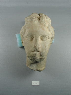  <em>Head, Aphrodite Type</em>. Marble, 7 5/8 x 4 15/16 x 5 11/16 in. (19.3 x 12.5 x 14.5 cm). Brooklyn Museum, Gift of Evangeline Wilbour Blashfield, Theodora Wilbour, and Victor Wilbour honoring the wishes of their mother, Charlotte Beebe Wilbour, as a memorial to their father, Charles Edwin Wilbour, 16.631. Creative Commons-BY (Photo: Brooklyn Museum, CUR.16.631_view1.jpg)