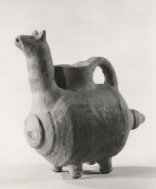 Possibly Cypriot. <em>Askos in the Form of a Quadruped</em>, ca. 1100-800 B.C.E. Terracotta, pigment, 4 15/16 x 2 11/16 x 4 3/4 in. (12.6 x 6.8 x 12 cm). Brooklyn Museum, Gift of Evangeline Wilbour Blashfield, Theodora Wilbour, and Victor Wilbour honoring the wishes of their mother, Charlotte Beebe Wilbour, as a memorial to their father, Charles Edwin Wilbour, 16.638. Creative Commons-BY (Photo: Brooklyn Museum, CUR.16.638_print_NegC_bw.jpg)