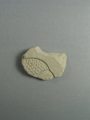  <em>Trial Piece Fragment with Wig and Forehead</em>, ca. 1352-1332 B.C.E. Liimestone, 2 3/16 × 2 1/2 × 1/2 in. (5.5 × 6.4 × 1.2 cm). Brooklyn Museum, Gift of Evangeline Wilbour Blashfield, Theodora Wilbour, and Victor Wilbour honoring the wishes of their mother, Charlotte Beebe Wilbour, as a memorial to their father, Charles Edwin Wilbour, 16.658. Creative Commons-BY (Photo: , CUR.16.658_view01.jpg)