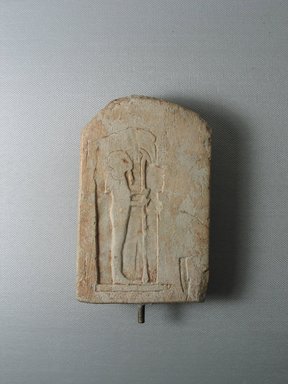  <em>Unfinished Votive Stela of Ptah</em>, ca. 1539-1075 B.C.E. Limestone, 5 9/16 × 3 3/8 × 3/4 in. (14.1 × 8.6 × 1.9 cm). Brooklyn Museum, Gift of Evangeline Wilbour Blashfield, Theodora Wilbour, and Victor Wilbour honoring the wishes of their mother, Charlotte Beebe Wilbour, as a memorial to their father, Charles Edwin Wilbour, 16.91. Creative Commons-BY (Photo: Brooklyn Museum, CUR.16.91_view4.jpg)