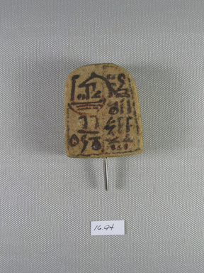  <em>Votive Stela</em>, ca. 1539-1075 B.C.E. Sandstone, pigment, 2 5/16 × 1 15/16 × 13/16 in. (5.9 × 5 × 2 cm). Brooklyn Museum, Gift of Evangeline Wilbour Blashfield, Theodora Wilbour, and Victor Wilbour honoring the wishes of their mother, Charlotte Beebe Wilbour, as a memorial to their father, Charles Edwin Wilbour, 16.94. Creative Commons-BY (Photo: Brooklyn Museum, CUR.16.94_view1.jpg)