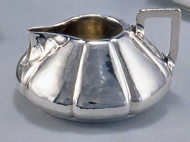 Shreve & Company (founded 1852). <em>Creamer, from Three Piece Tea Service</em>, ca. 1910. Silver, wood, 2 1/2 x 4 5/8 x 4 1/4 in. (6.4 x 11.7 x 10.8 cm). Brooklyn Museum, Gift of Mr. and Mrs. Daniel L. Silberberg, by exchange, 1989.22.2. Creative Commons-BY (Photo: Brooklyn Museum, CUR.1989.22.2.jpg)