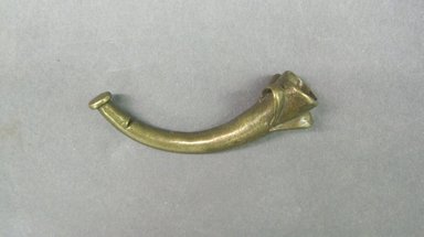 Akan. <em>Gold-weight (abrammuo): side-blown horn</em>, ca. 1700-1900. Copper alloy, length: 3 in. (length: 7.5 cm. Brooklyn Museum, Gift of Shirley B. Williams, 1990.221.62. Creative Commons-BY (Photo: Brooklyn Museum, CUR.1990.221.62.jpg)