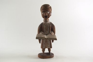 Thomas Ona Odulate (Yorùbá, Nigerian, ca. 1900–1952). <em>Figure of a Clergyman</em>, early 20th century. Wood, pigment, 9 3/16 x 3 1/4 in. (23.2 x 8.2 cm). Brooklyn Museum, Caroline H. Polhemus Fund, 1991.175.2. Creative Commons-BY (Photo: Brooklyn Museum, CUR.1991.175.2_front_PS5.jpg)