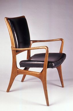 Vladimir Kagan (American, born Germany, 1927–2016). <em>Armchair</em>, ca. 1953. Walnut, leather, 34 1/2 x 22 7/16 x 25 in. (87.6 x 56.9 x 63.5 cm). Brooklyn Museum, Gift of the artist, 1991.255.2. Creative Commons-BY (Photo: Brooklyn Museum, CUR.1991.255.2.jpg)