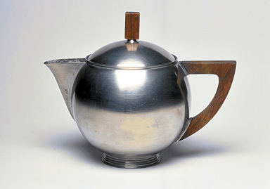 Marion Anderson Noyes (American, 1907–2002). <em>Teapot with Lid</em>, ca. 1933. Pewter, walnut, 6 3/4 x 8 5/8 x 5 3/8 in. (17.1 x 21.9 x 13.7 cm). Brooklyn Museum, Gift of Marion Anderson Noyes, 1991.258.1a-b. Creative Commons-BY (Photo: Brooklyn Museum, CUR.1991.258.1a-b.jpg)