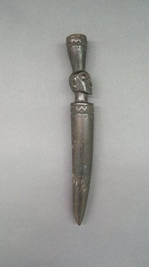 Yorùbá. <em>Divination Tapper with Human Head</em>, early 20th century. Wood, 9 3/4   x  1  x  1 1/2 in.  (24.8 x 2.5 x 3.8 cm). Brooklyn Museum, Gift of Drs. Noble and Jean Endicott, 1992.136.10. Creative Commons-BY (Photo: Brooklyn Museum, CUR.1992.136.10.jpg)