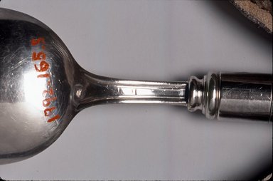 Walter Dorwin Teague (American, 1883-1960). <em>Spoon</em>, ca. 1930. Silver-plate, glass, 7 3/4 x 1 5/8 x 7/8 in.  (19.7 x 4.1 x 2.2 cm). Brooklyn Museum, Gift of Denis Gallion and Daniel Morris, 1992.165.5. Creative Commons-BY (Photo: Brooklyn Museum, CUR.1992.165.5_mark.jpg)