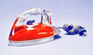 Saunders Corporation (ca. 1858–1946). <em>"Silver Streak" Iron</em>, ca. 1946. Pyrex glass, metal, cloth and plastic, 5 1/2 x 9 1/4 x 3 7/8 in. (14.0 x 23.5 x 9.9 cm). Brooklyn Museum, Gift of Donald F. Wilkes, 1992.167. Creative Commons-BY (Photo: Brooklyn Museum, CUR.1992.167.jpg)