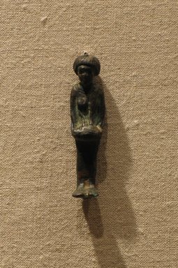  <em>Woman with Barrel-Shaped Drum</em>, ca. 712-305 B.C.E. Bronze, Height: 1 13/16 in. (4.6 cm). Brooklyn Museum, Gift of Mr. and Mrs. Michael Ward, 1992.169. Creative Commons-BY (Photo: Brooklyn Museum, CUR.1992.169_wwg8.jpg)