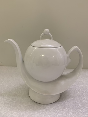 Erich Rozewicz (French, born Poland, 20th century). <em>Teapot with Lid from a Three Piece Tea Set, Monoikos Pattern</em>, ca. 1990. Porcelain, 8 x 9 1/4 x 4 3/4 in.  (20.3 x 23.5 x 12.1 cm). Brooklyn Museum, Gift of Erich Rozewicz and Manufacture de Monaco, 1992.244.1a-b. Creative Commons-BY (Photo: , CUR.1992.244.1a-b.jpg)