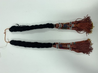  <em>Pair of Plait Ornaments</em>. Artificial beads, wool braid, Doubled: 14 15/16 in. (38 cm). Brooklyn Museum, Gift of Mr. and Mrs. J. Garrison Stradling, 1992.79.8a-b. Creative Commons-BY (Photo: Brooklyn Museum, CUR.1992.79.8a-b.JPG)