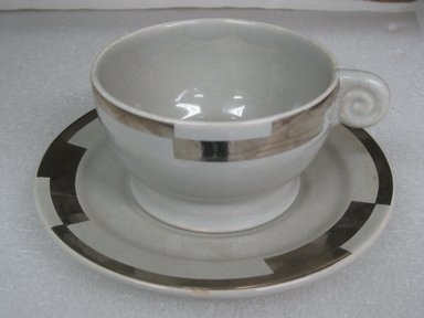 Jean Luce (French, 1895-1964). <em>Cup and Saucer</em>, ca. 1930. Glazed earthenware, a) cup: 2 1/4 x 4 1/4 x 3 3/4 in. (5.7 x 10.8 x 9.5 cm). Brooklyn Museum, Gift of Mark Isaacson, 1992.92.31a-b. Creative Commons-BY (Photo: Brooklyn Museum, CUR.1992.92.31a-b.jpg)