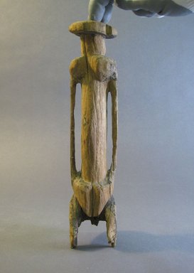 Dogon. <em>Standing Female Figure</em>, 19th century or earlier. Wood, 11 1/4 x 2 1/2 x diam: 2 1/2 in. (28.5 x 6.3 x diam: 6.3 cm). Brooklyn Museum, Gift of Dorothy Robbins, 1994.184.3. Creative Commons-BY (Photo: Brooklyn Museum, CUR.1994.184.3_front.jpg)