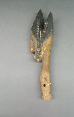Bamana. <em>Head and Neck of a Female Puppet</em>, 20th century. Wood, white metal, pigment, 12 1/4 x 2 1/4 x 3 1/8in. (31.1 x 5.7 x 7.9cm). Brooklyn Museum, Gift of Allen C. Davis, 1995.171.8. Creative Commons-BY (Photo: Brooklyn Museum, CUR.1995.171.8_overall.jpg)