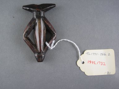 Mossi. <em>Whistle</em>, 20th century. Wood, 3 3/8 x 1 7/8 x 5/8 in. (8.6 x 4.8 x 1.6 cm). Brooklyn Museum, Gift of Drs. Noble and Jean Endicott, 1995.173.2. Creative Commons-BY (Photo: Brooklyn Museum, CUR.1995.173.2_front.jpg)