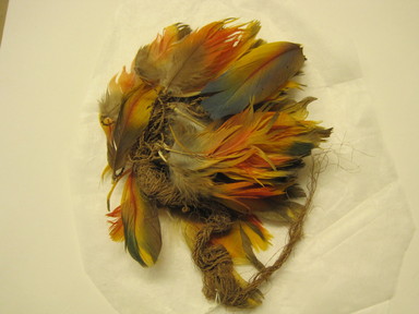 Coastal Wari. <em>Fan?, Fragment</em>, 600-1000. Feathers, bast fiber, 4 3/4 × 1 × 6 1/2 in. (12.1 × 2.5 × 16.5 cm). Brooklyn Museum, Gift of Kay Hodnett Nunez, 1995.47.84. Creative Commons-BY (Photo: , CUR.1995.47.84.jpg)