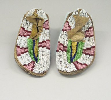 Plains. <em>Pair of Beaded Moccasins for a Child</em>, late 19th-early 20th century. Hide, beads, pigment, sinew, L: 5 3/4 in. W: 2 1/2 in. Brooklyn Museum, Gift of Betsy Stern, 1996.172.1a-b. Creative Commons-BY (Photo: Brooklyn Museum, CUR.1996.172.1a-b.jpg)