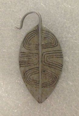 Turkana. <em>Earring (Akaparaparat)</em>, mid-20th century. Aluminum, 3 x 1 1/2 in. (7.6 x 3.8 cm). Brooklyn Museum, Gift of Donna Klumpp Pido, 1996.204.19. Creative Commons-BY (Photo: Brooklyn Museum, CUR.1996.204.19_overall.jpg)