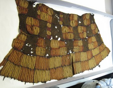 Dida. <em>Woman's Skirt</em>, early 20th century. Raffia fiber, dyes, 58 1/2 x 25 1/2 in. (148.6 x 64.8 cm). Brooklyn Museum, Gift of William C. Siegmann, 1997.172.6. Creative Commons-BY (Photo: Brooklyn Museum, CUR.1997.172.6_overall.jpg)