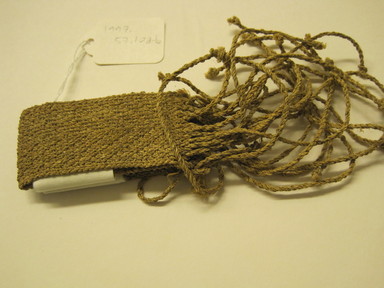  <em>Pair of Bracelets, Joined</em>, 20th century. Leaf fiber, length(incl.fringe): 9 in. (17.8 cm). Brooklyn Museum, Gift of Nobuko Kajitani, 1997.57.10a-b. Creative Commons-BY (Photo: , CUR.1997.57.10a-b.jpg)