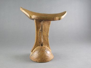 Sidamo. <em>Headrest</em>, 20th century. Wood, hide, 6 5/8 x 6 3/16 x 4 3/4 in.  (16.8 x 15.7 x 12.1 cm). Brooklyn Museum, Gift of Serge and Jodie Becker-Patterson, 1998.124.2. Creative Commons-BY (Photo: Brooklyn Museum, CUR.1998.124.2_side_view1.jpg)